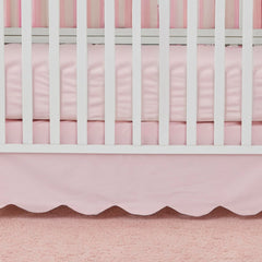Brandream scallop edge crib skirt draped on crib highlights elegant design for coordinated nurseries.