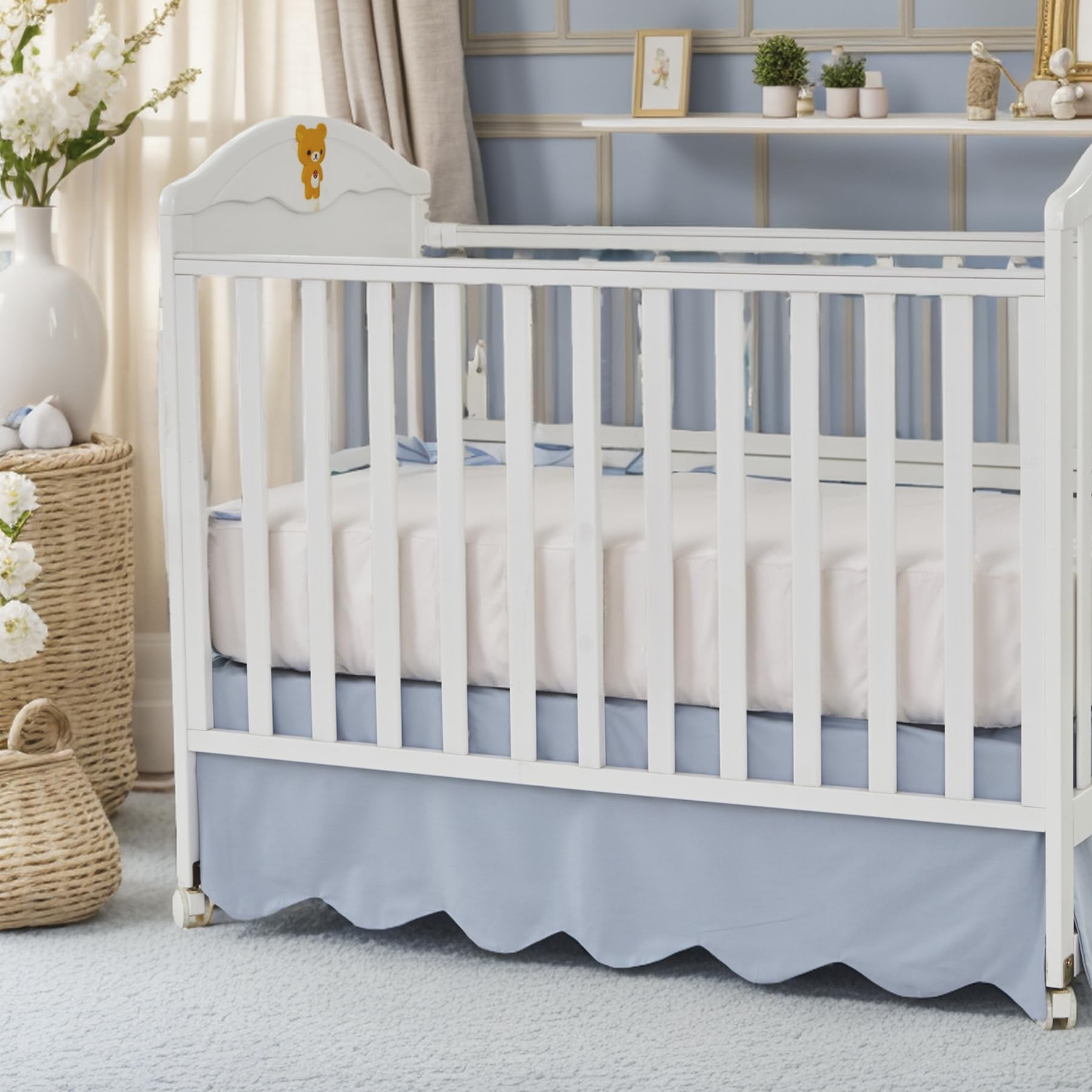Brandream scallop edge crib skirt in mist blue enhances nursery elegance and tidies under-crib space.