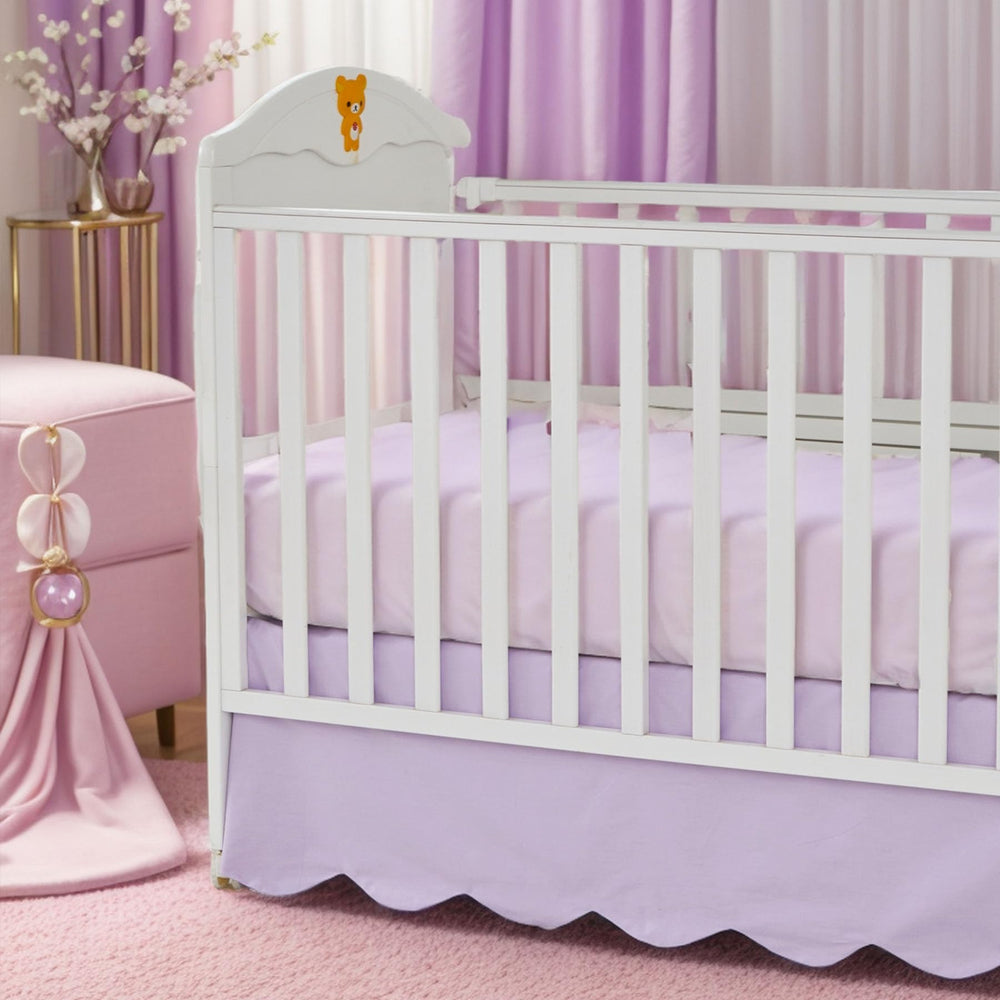 Brandream scallop edge crib skirt in purple adds refined nursery elegance.