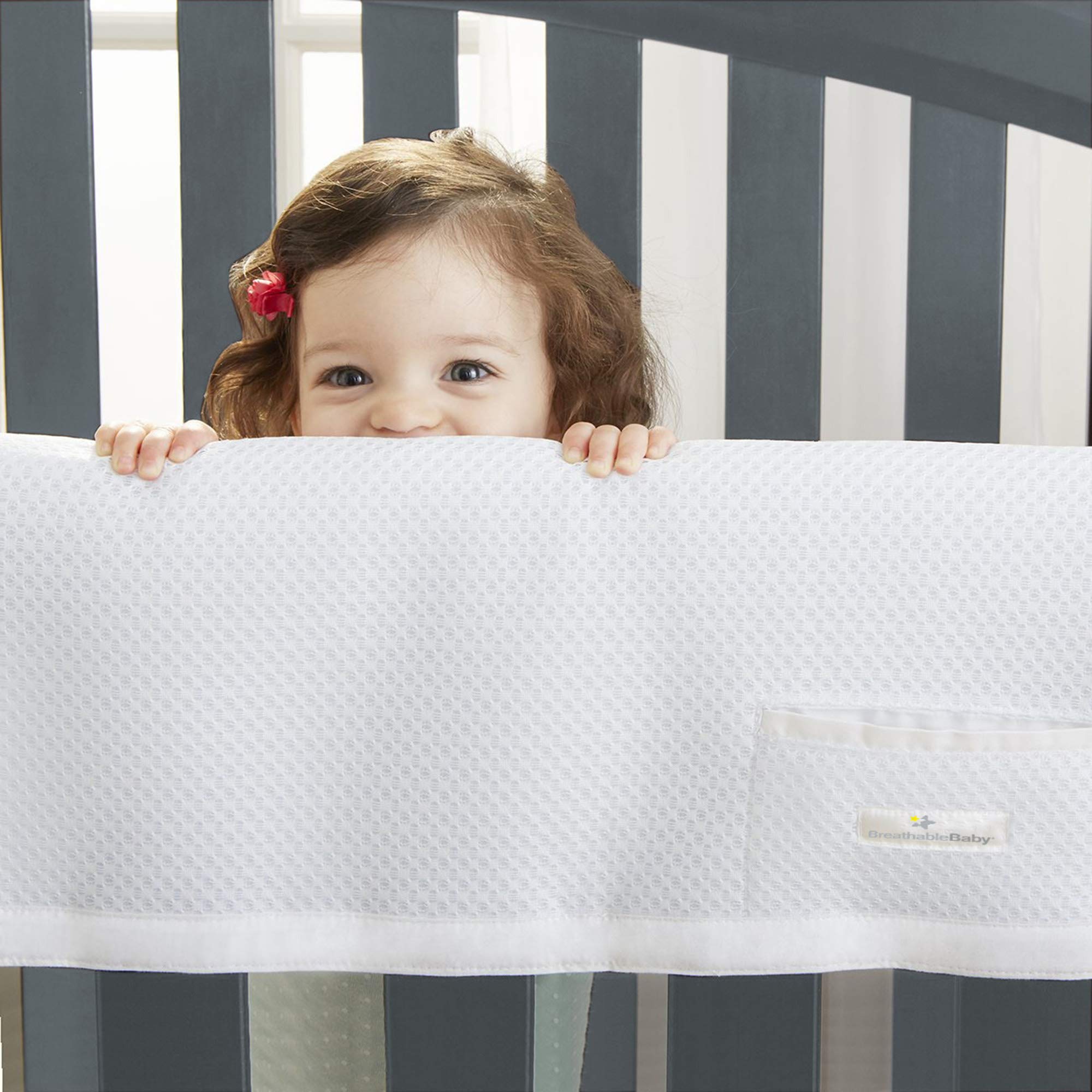 BreathableBaby crib-rail-protection mesh-cover demonstrates breathability and coverage across rails.