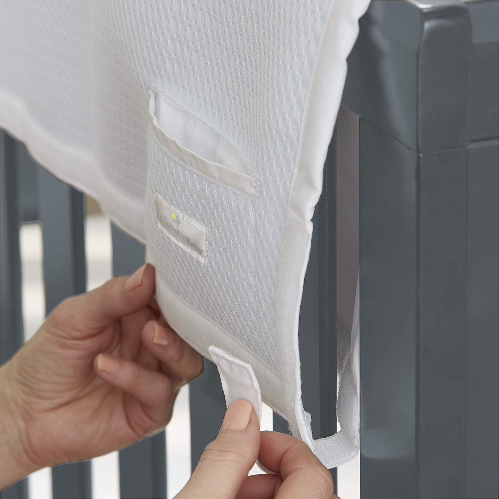 BreathableBaby railguard-pocket demonstrates pacifier and teether within reach.