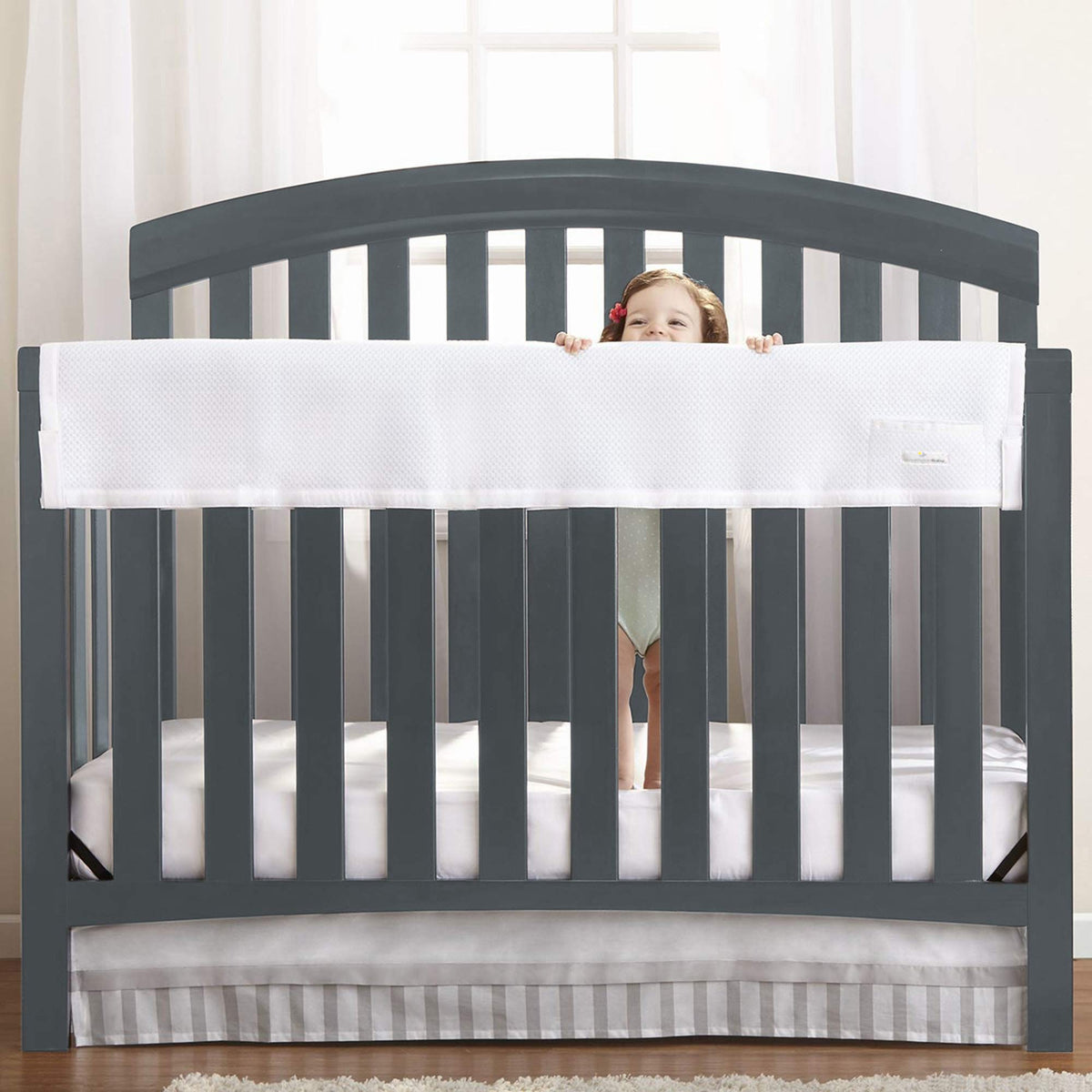 BreathableBaby RailGuard long-panel on crib rail provides teether protection and coverage.