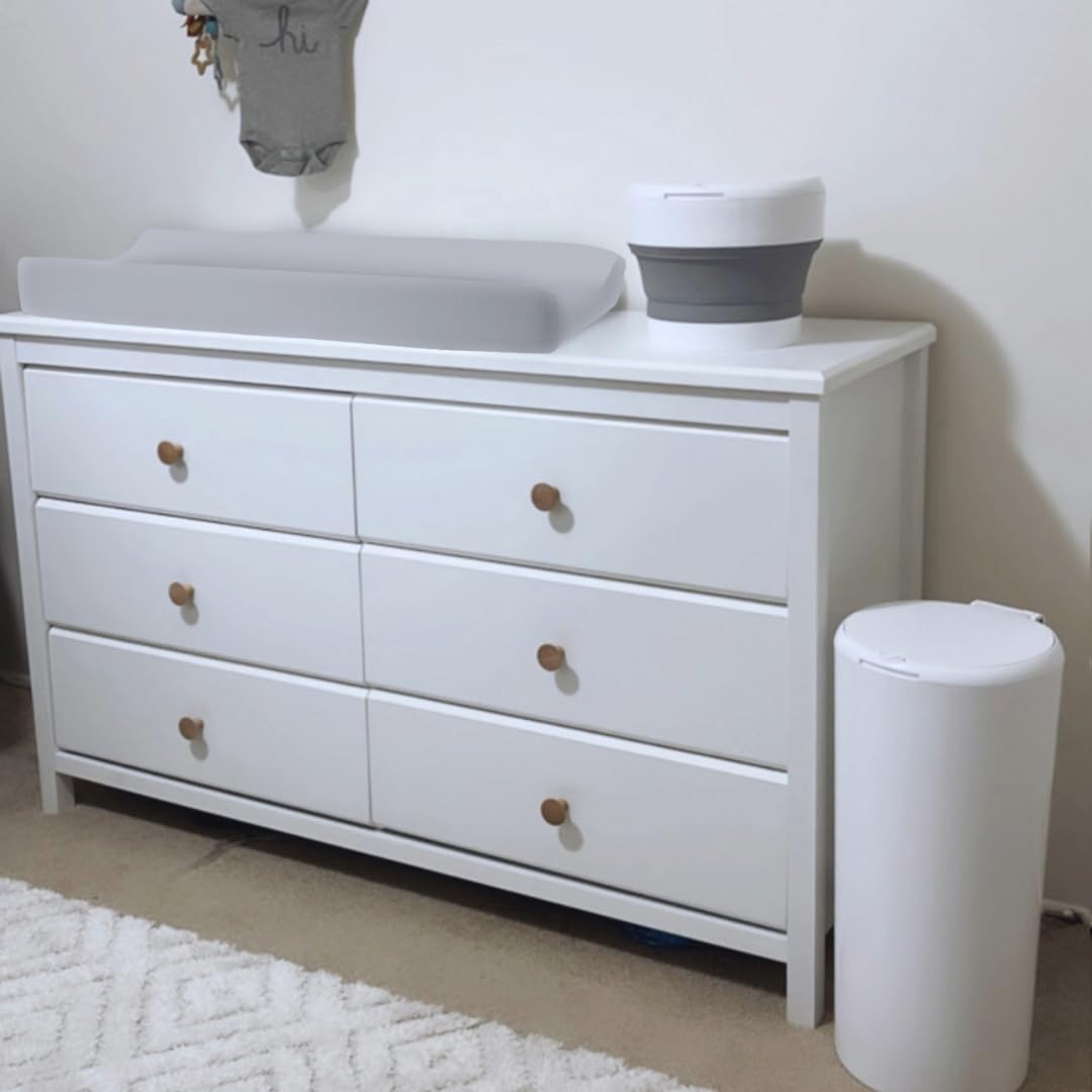 Gray BreathableBaby cover complements nursery decor while protecting against moisture.