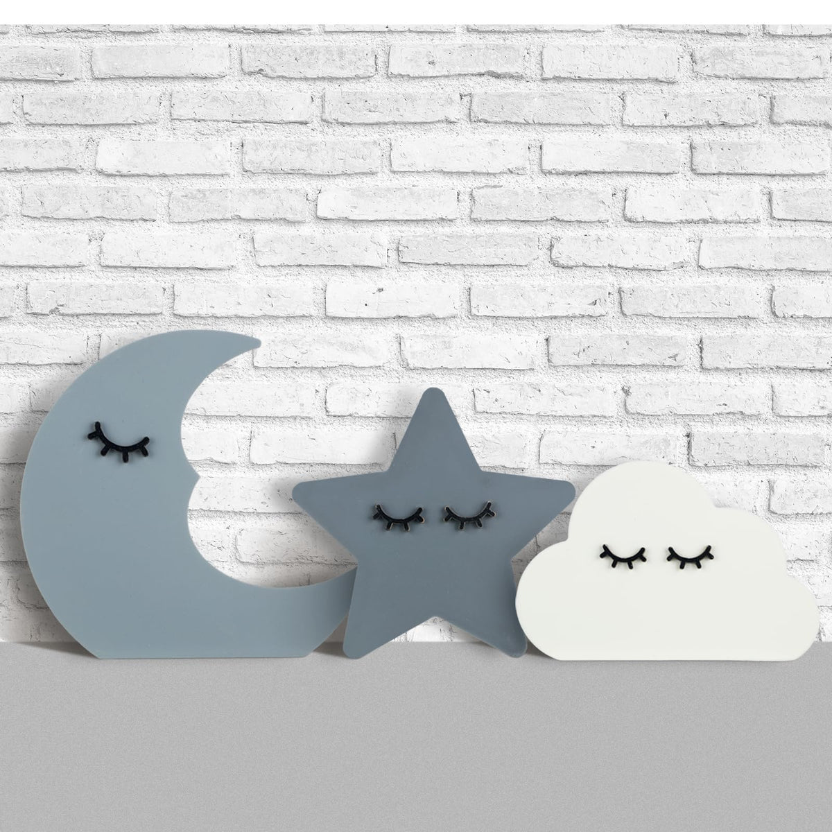 Briwooody moon wall decor adds calming celestial touch to the nursery.