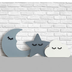 Briwooody moon wall decor adds calming celestial touch to the nursery.