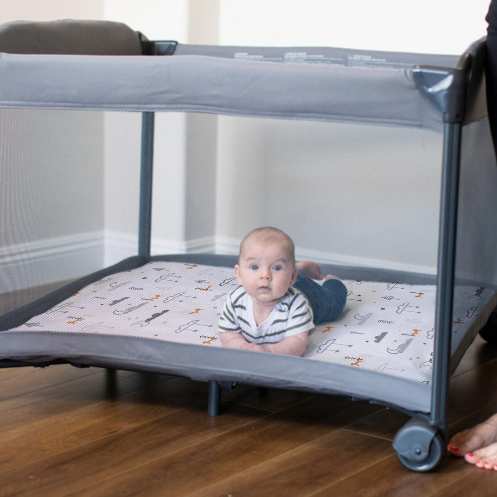 BROLEX Convertible playard mattress cover fitted on a travel bed.