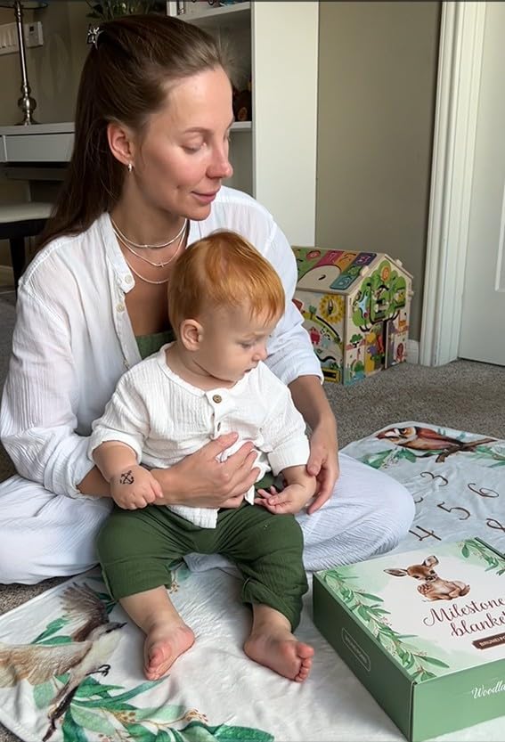 Large 50 by 40 inch blanket fits baby and parents in photos.