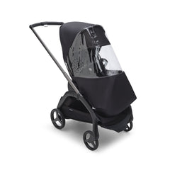 Bugaboo Dragonfly Rain Cover attached for wind protection during a park walk