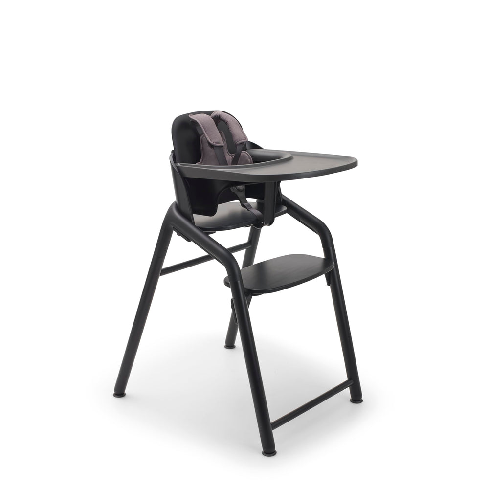 Bugaboo Giraffe high chair adjusts in one second for growing children at the table.