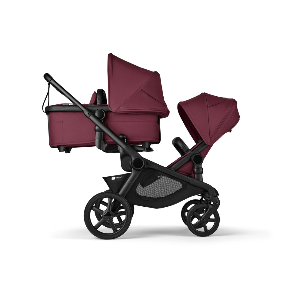 Bugaboo Kangaroo dark cherry right-side view shows tandem stroller compatibility on the move.