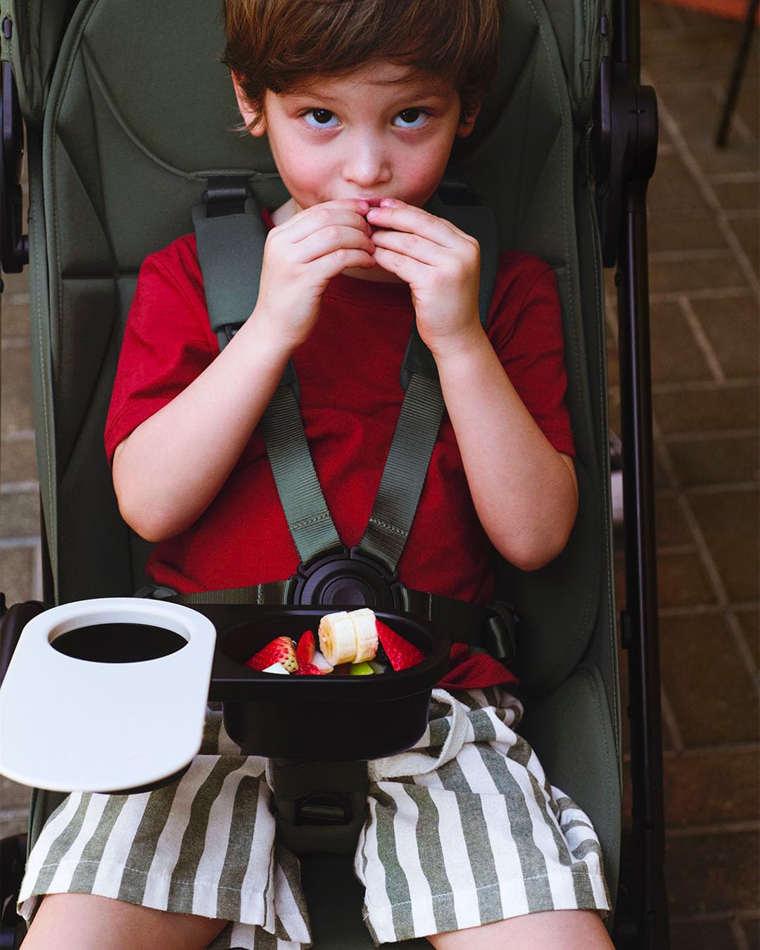 Bugaboo snack tray rotates for quick child entry and access.