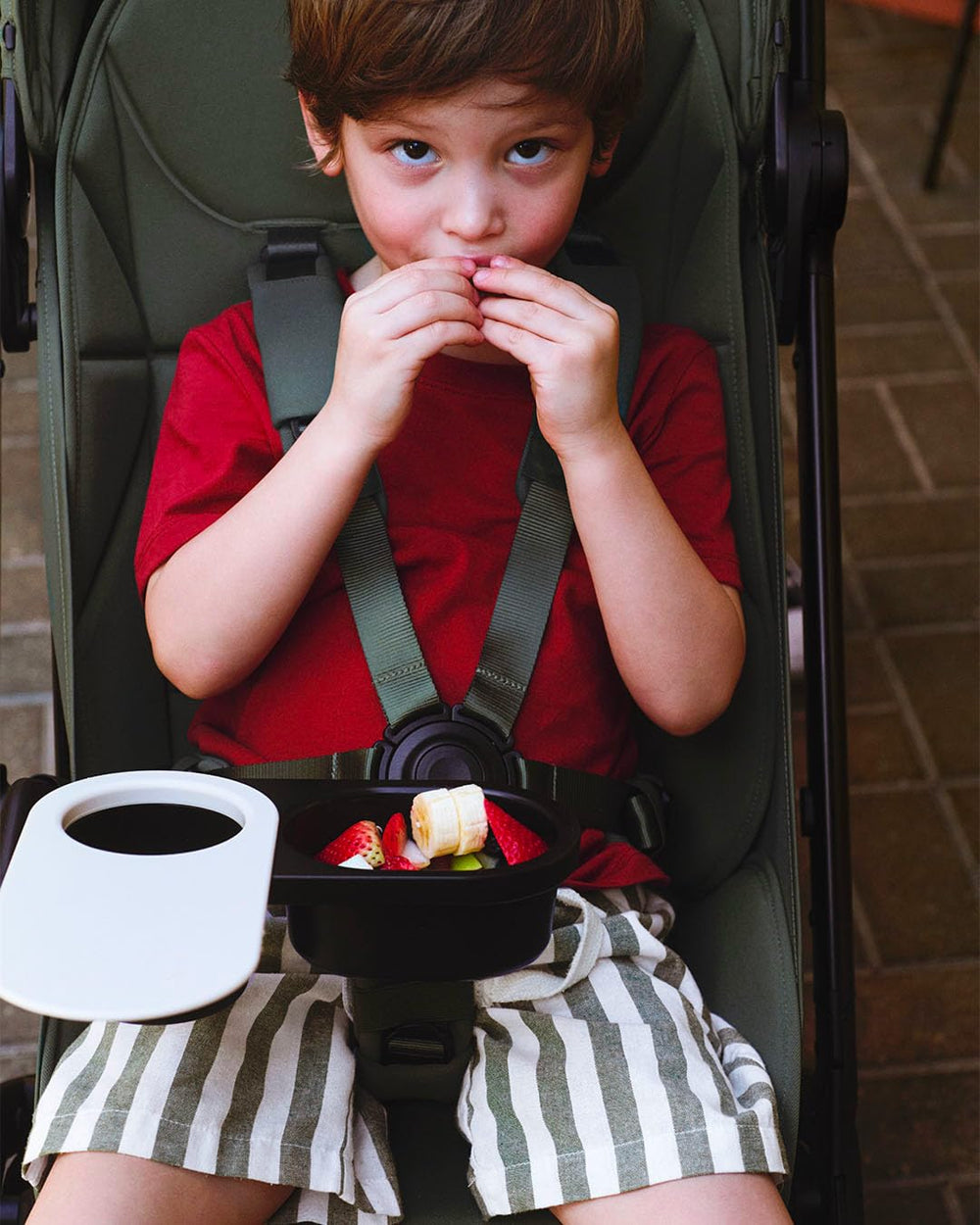 Bugaboo snack tray rotates for quick child entry and access.