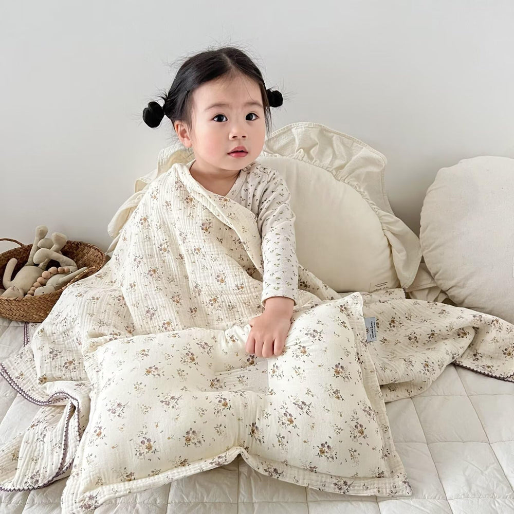 BuLuTu muslin blanket floral design enhances nursery ambiance.