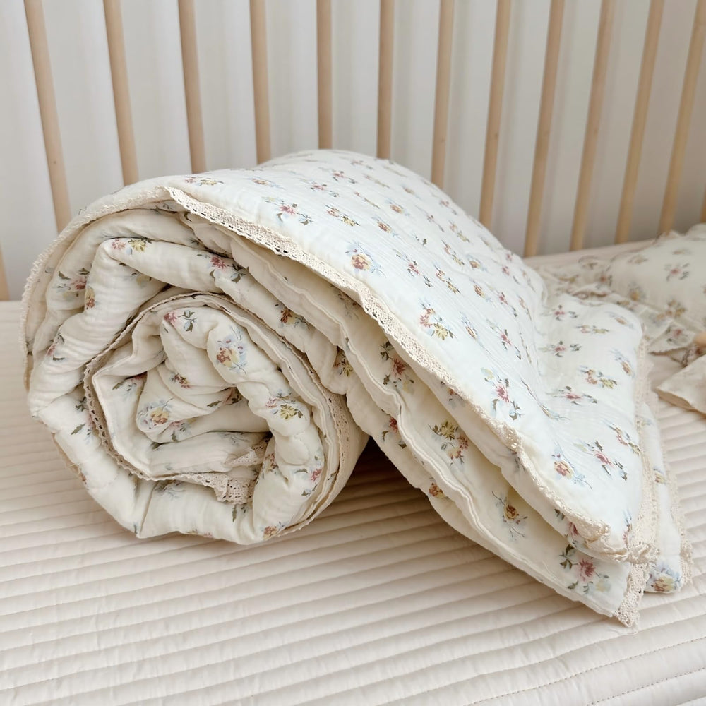 BuLuTu crib quilt azalea pattern adds cheerful decor.