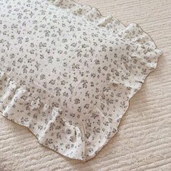 Bulutu pillowcase edge with ruffles and floral print adds charming nursery decor