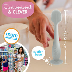 Bumco suction base stand keeps the spatula upright during diaper changes.