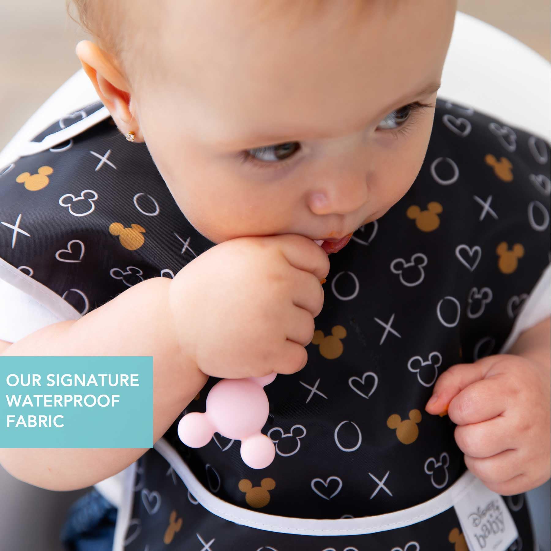 Adjustable strap on Bumkins bib provides quick, tug-proof fit.