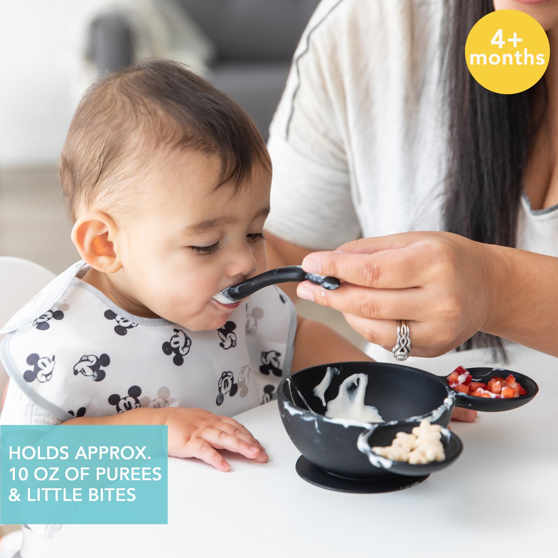 Bumkins Mickey Mouse bowl includes a silicone spoon for teething-friendly feeding.