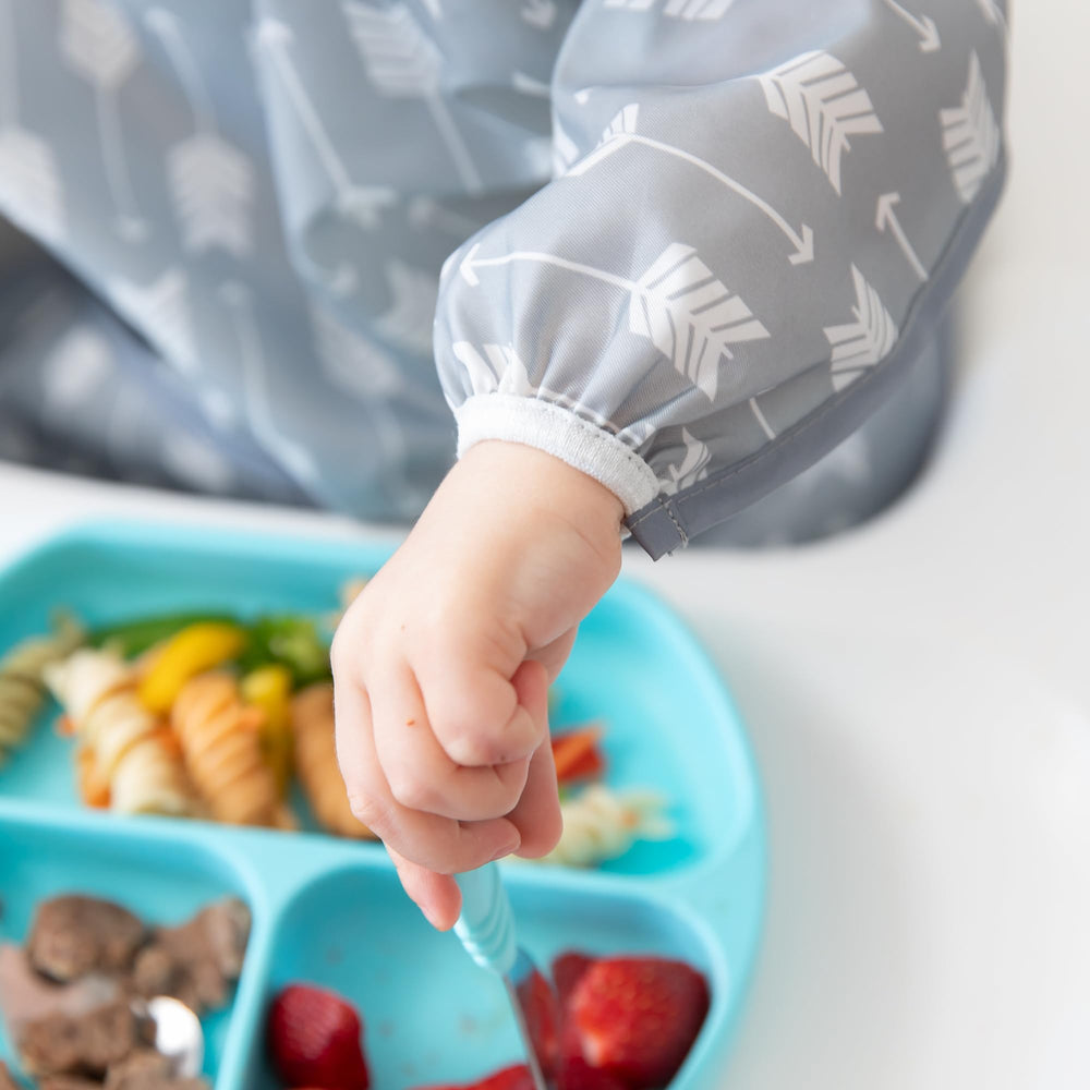 Bumkins waterproof fabric sleeved bib protects outfits during meals.