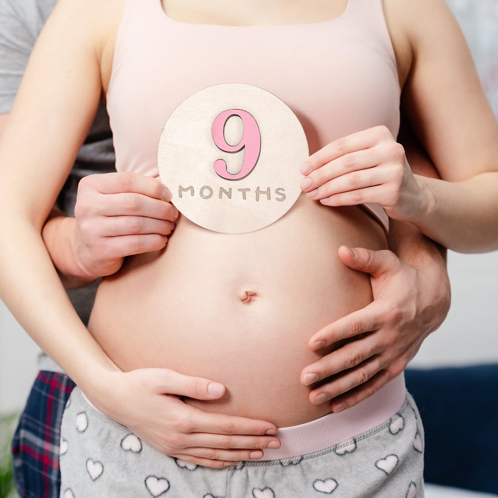 Burbell pink wooden disc adds natural texture to nursery decor and photos