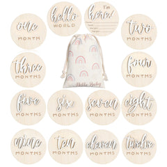 Burbell 7 Pack 3D milestone discs placed in a newborn photo setup, highlighting monthly growth.