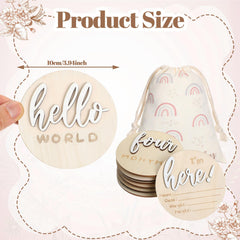 Burbell wooden baby milestone sign with 3D carvings on a nursery shelf.