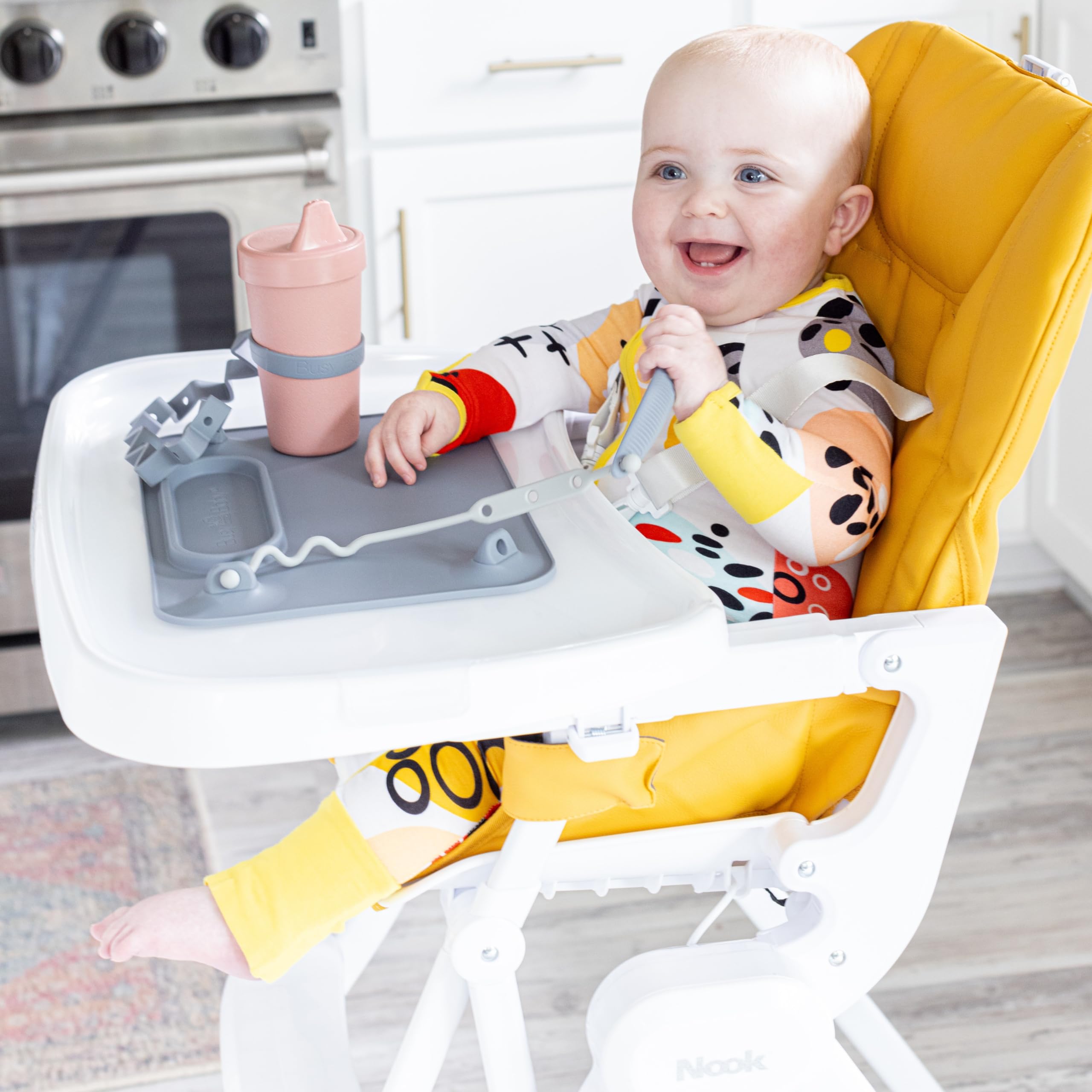 Busy Baby Bottle Bungee pewter on table during playtime