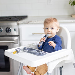 Textured surface on Busy Baby Mini Mat provides tactile exploration during feeding.