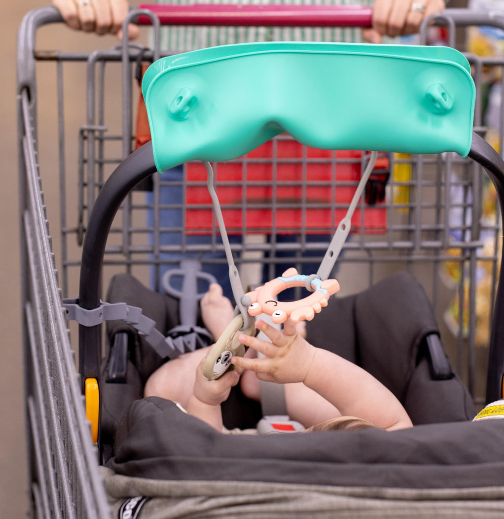 Busy Baby Bungee pairs with Busy Baby mats and bibs for a coordinated setup.