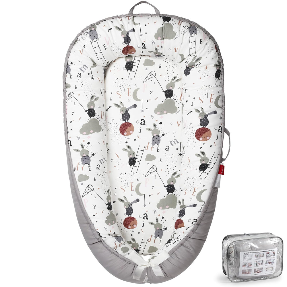 BUTOA baby lounger with breathable cover for comfortable supervised lounging.