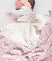 Buttzo baby blanket double-sided close-up highlights reversible softness for cuddling.