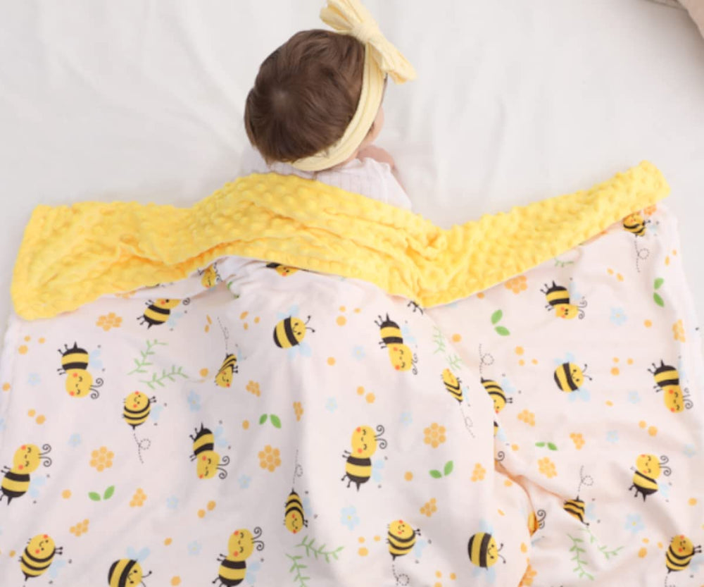 BUTTZO Bee Minky Blanket used as cuddling companion or stroller cover