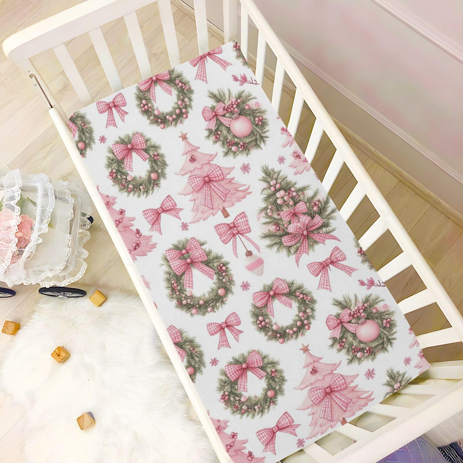 Caikeny pink bow pattern crib sheet adds cute detail and comfort