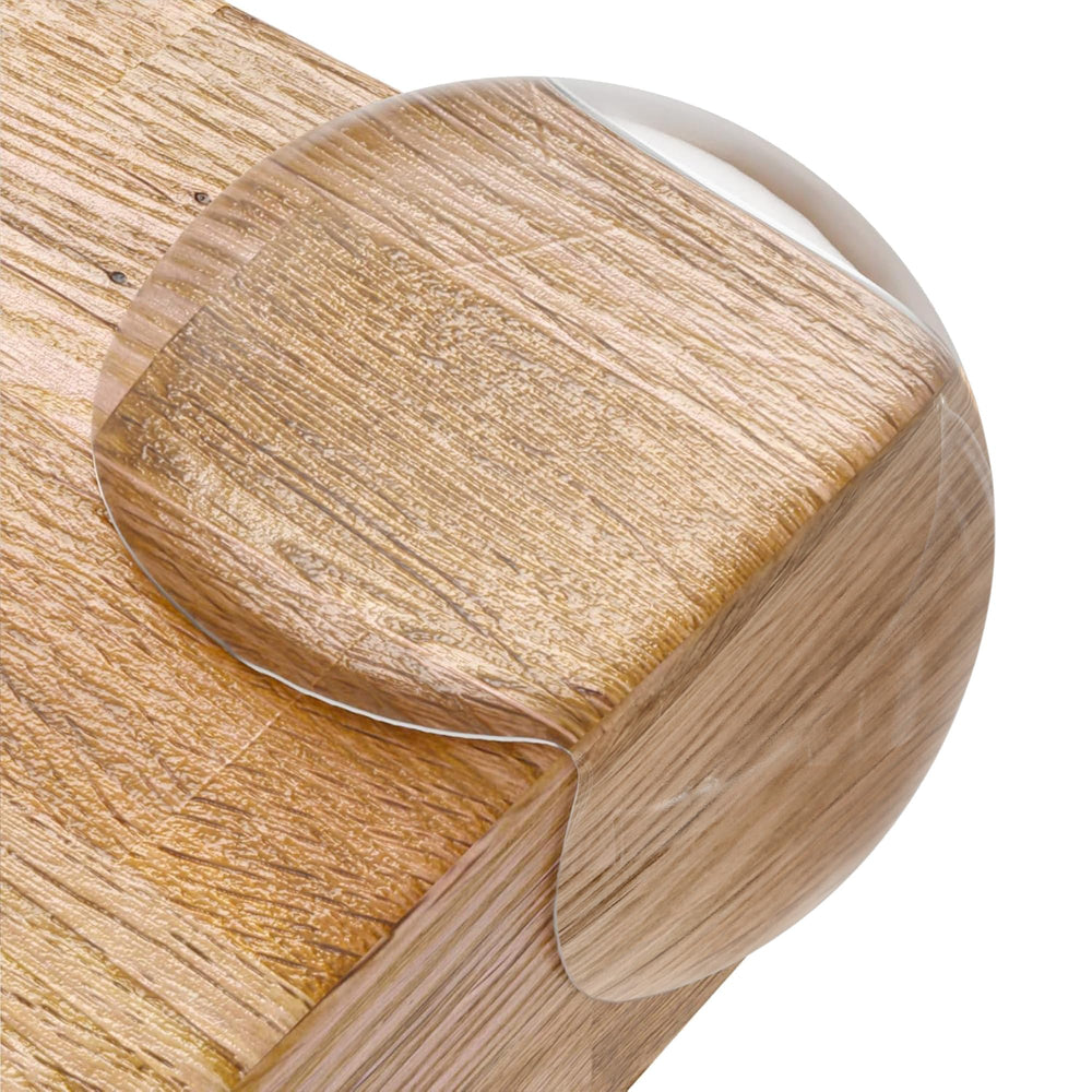 CalMyotis corner protector top view on a table edge, providing discreet edge safety.