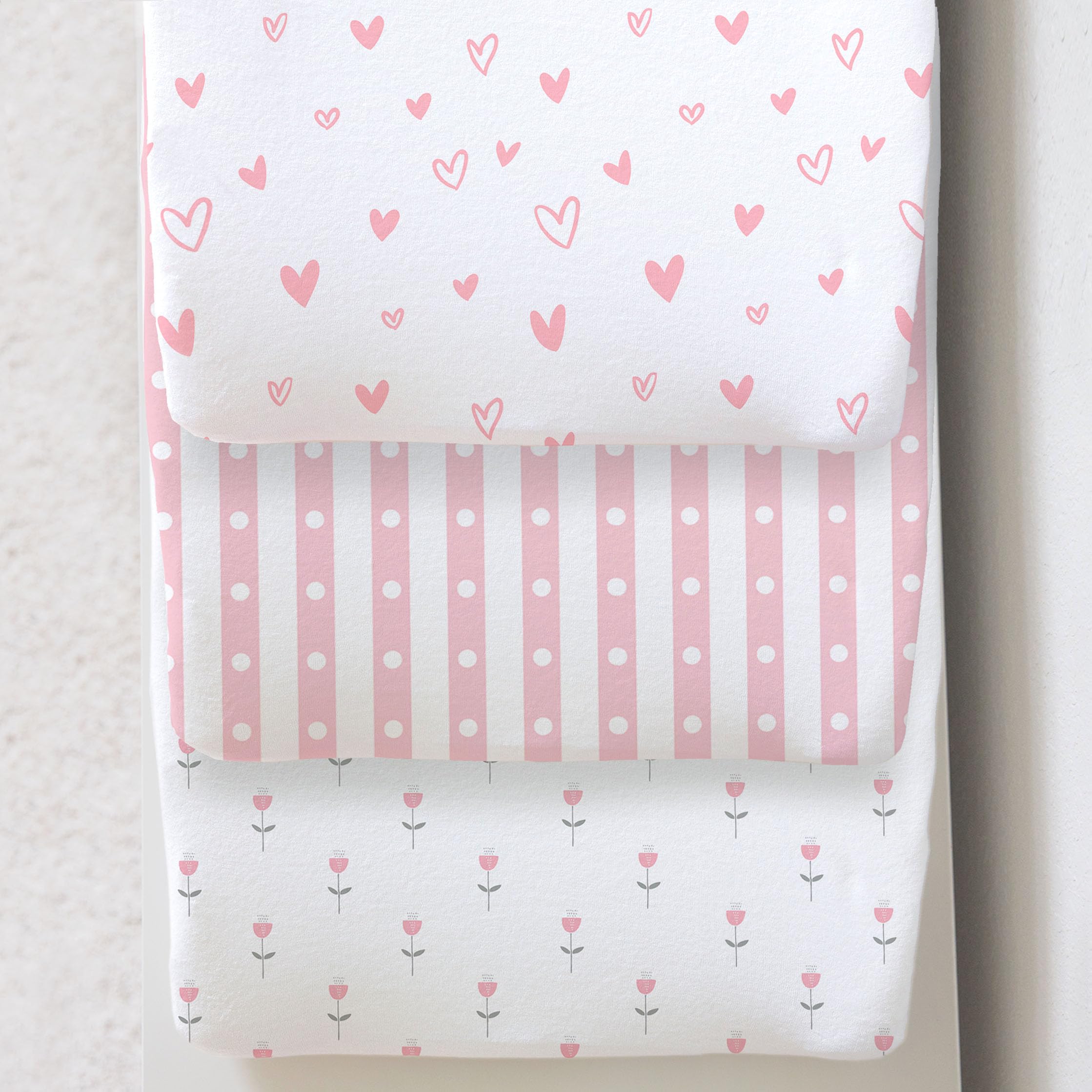Cambria Baby 3-pack organic cotton changing pad cover on a pad, soft and secure