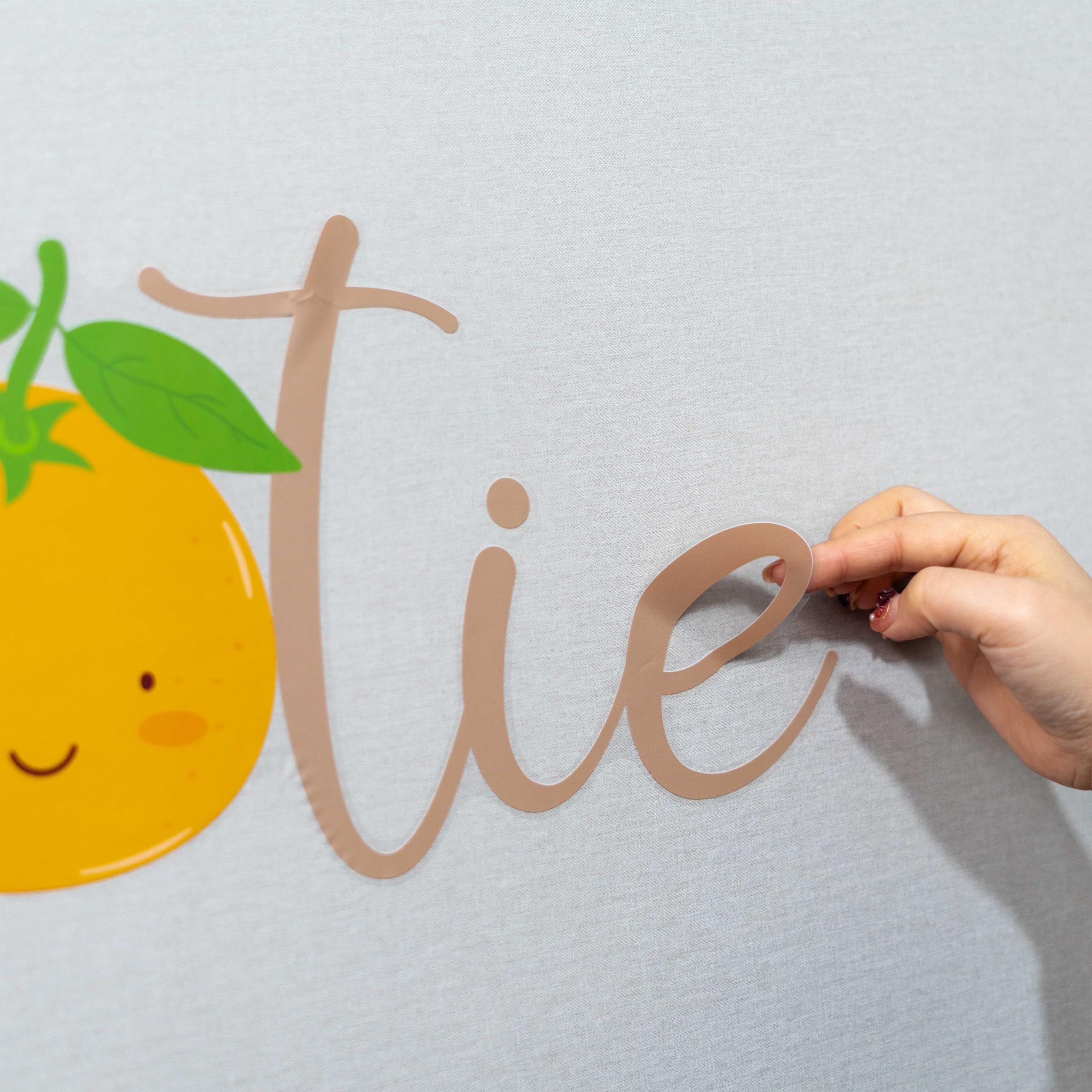 CANTLY A Little Cutie Is On The Way decorative orange party signage.