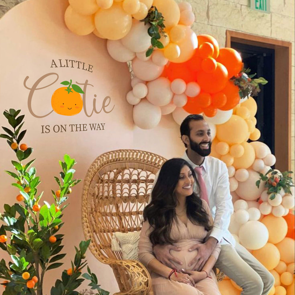 CANTLY A Little Cutie Is On The Way wall sticker adds festive orange vibes.