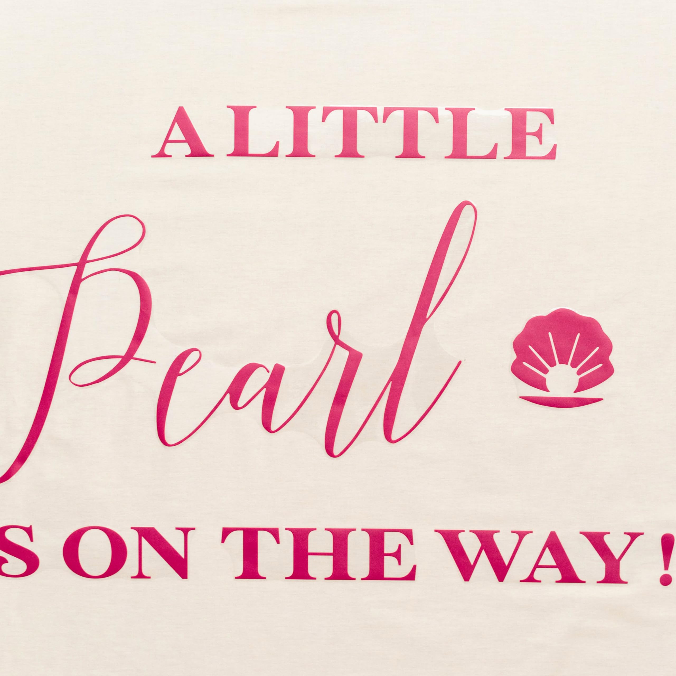 Capiont A Little Pearl decal used as photo backdrop for gender reveal