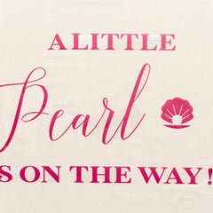 Capiont A Little Pearl decal used as photo backdrop for gender reveal