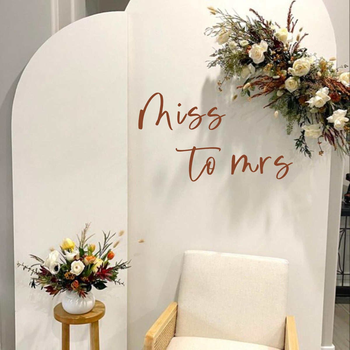Capiont Miss to Mrs decal on a balloon arch creates a romantic backdrop for photos