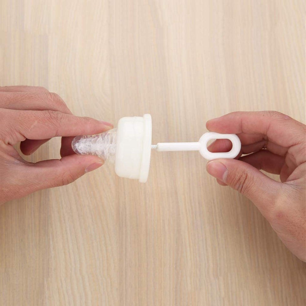 Caralin nipple brush shown cleaning the top edge of a nipple.