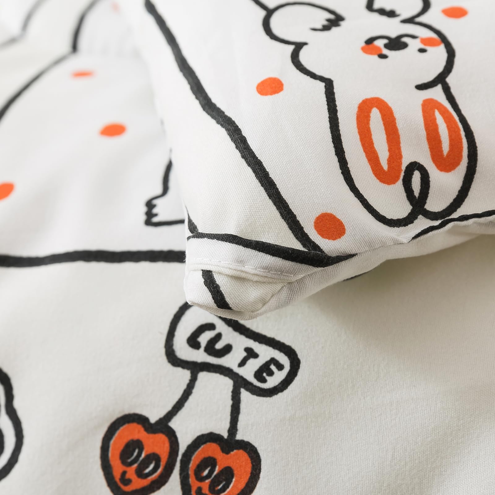 Caressma comforter close-up, silky microfiber texture and print detail