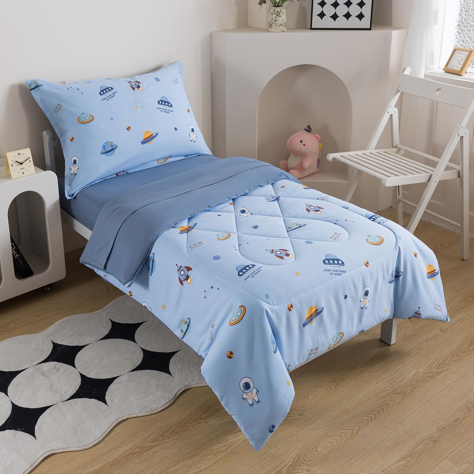 Caressma flat-sheet 45x60 showcases blue space pattern for a playful, restful night.