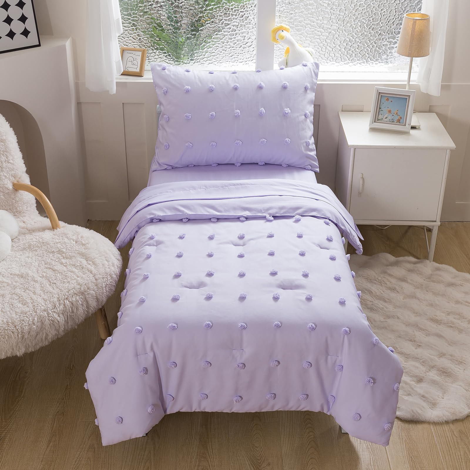 Caressma lavender fitted sheet fits standard toddler mattress securely.