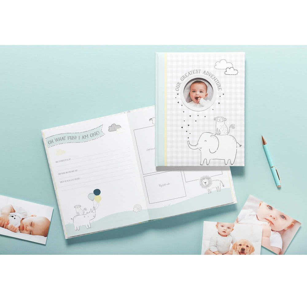 Carter's Our Greatest Adventure memory book pages opened reveal guided prompts for memories
