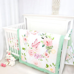 Caruili comforter featuring butterfly-floral pattern for a cozy nursery accent
