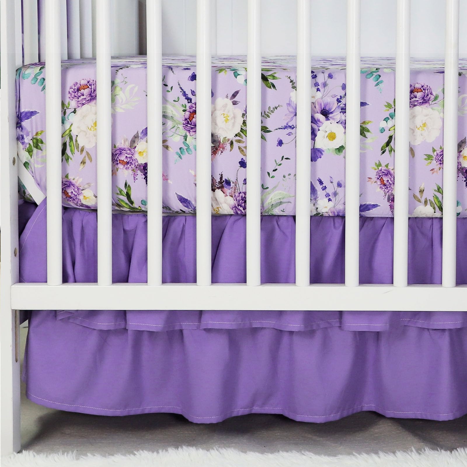 CARUILI ruffled crib skirt detail hides under-crib storage with a neat, decorative edge.