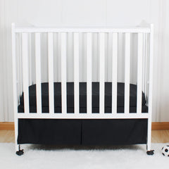 CaSaJa mini pleated black crib skirt with 12-inch drop.