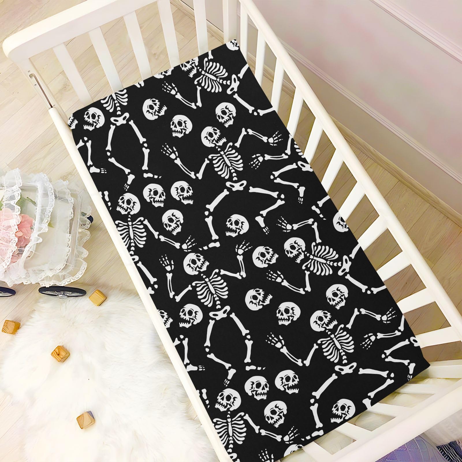 CaTaKu nursery skull print crib sheet decorating the room