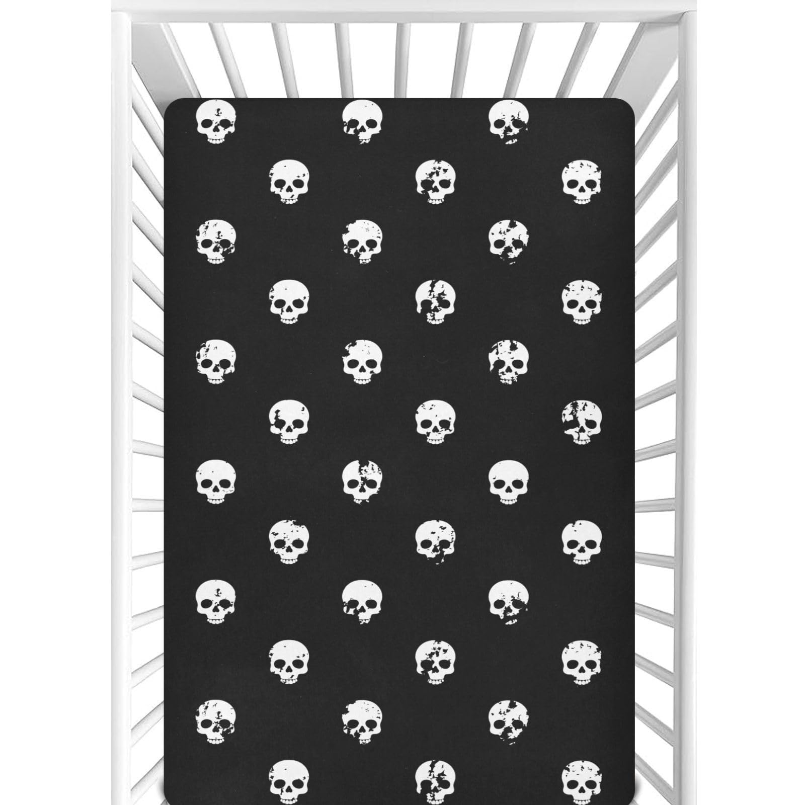 CaTaKu Skull Heads black mini crib sheet close-up showing soft fabric and secure fit